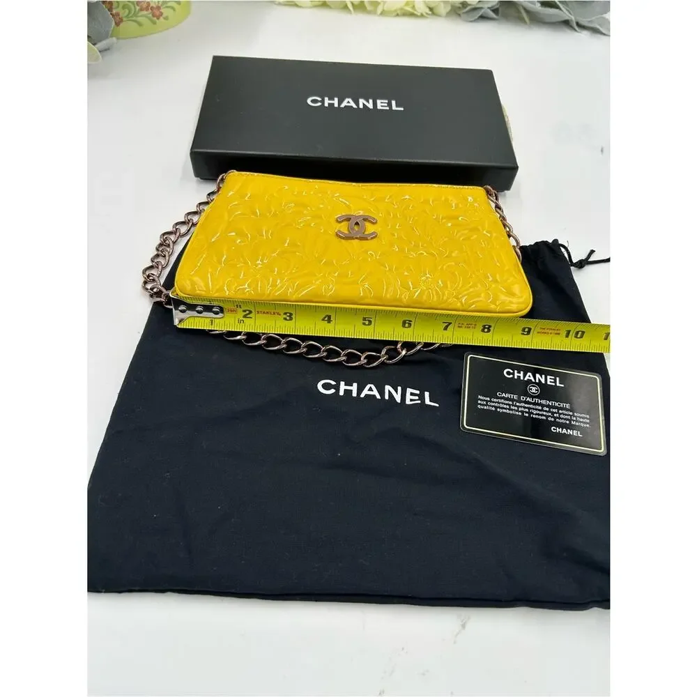 Women's Chanel patent leather floral embossed shoulder bag made in Italy